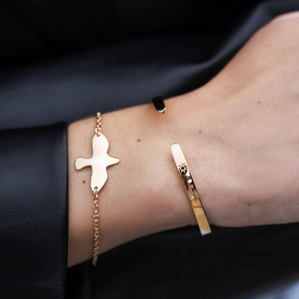Gold bracelet with a dove pendant